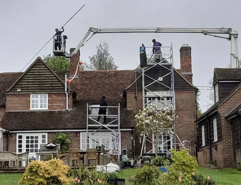 The Moss Cleaners using cherry picker and scaffolding to clean roof safely and professionally in 17 King St, Richmond TW9 1ND, UK, 17 King St, Richmond TW9 1ND, UK